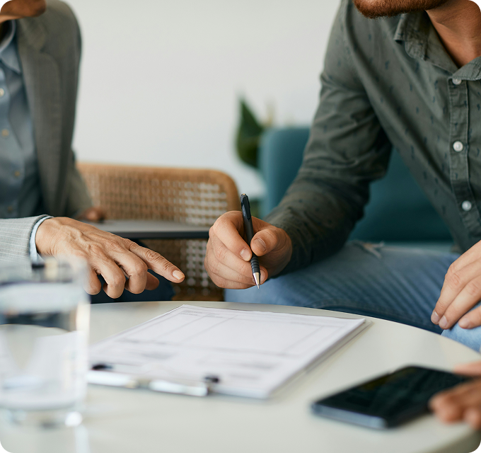 Insurance professionals reviewing a policy