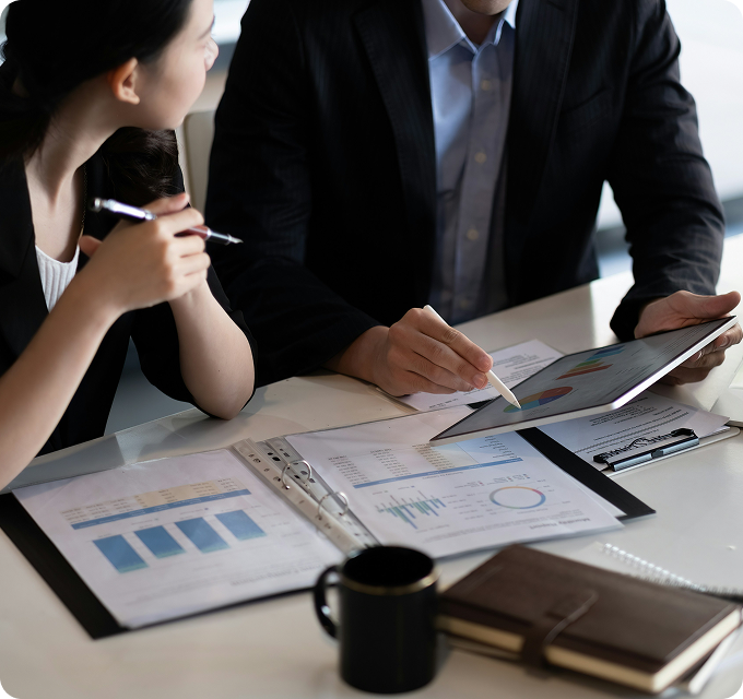 Investment professionals reviewing a portfolio